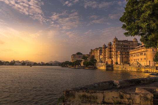 Udaipur City Palace and the Lake Pichola at sunset in Udaipur, Rajasthan, India