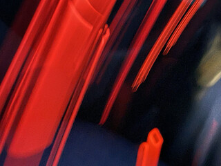 Closeup shot of red lights on the blurry background © Vladimir Volokhin/Wirestock