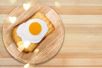 Breakfast with fried egg and toasted bread. Valentines day food
