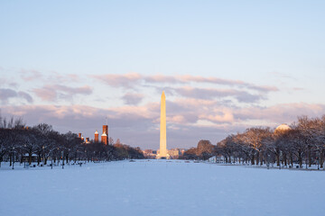National Mall and the Washington Monument covered in snow during sunrise right after a snowstorm
