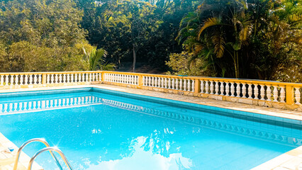 photo of the swimming pool of the place in sunny day