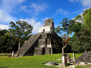 Mayan temple in Tikal, Guatemala under a blue sky