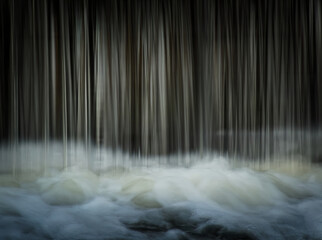 Closeup of a small waterfall with long exposure in the daylight - perfect for wallpapers © Leigh Windridge/Wirestock