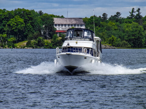 Modern yacht on Lake Simcoe surrounded by greenery in Ontario, Canada