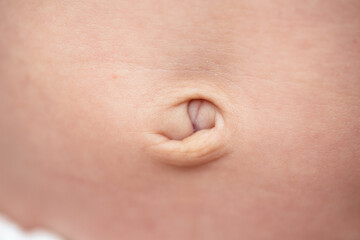 Close-up shot of a belly button of a small baby