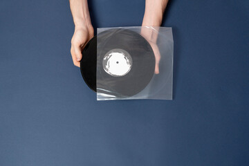 top view of music lover holding vinyl music record
