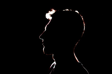 dark backlight shadow silhouette of male person, incognito unknown profile