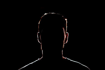 dark backlight shadow silhouette of male person, incognito unknown profile