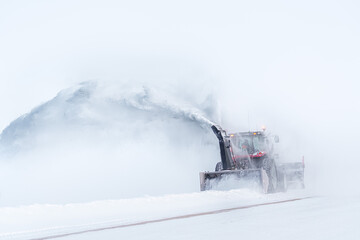 Machine removing the snow after a winter storm