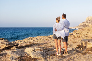 Mature couple resting at sea resort.