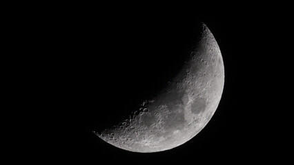 Monochrome shot of Waning Crescent Moon against a black background