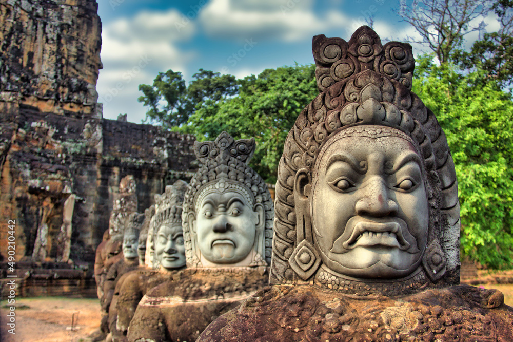 Poster closeup shot of statues near the angkor wat in siem reap, cambodia