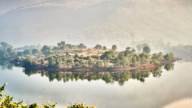 Panoramic Shot Of A Beautiful Green Island With A Foggy Weather