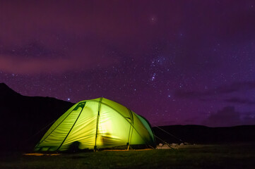 Beautiful view of Starry night camping © Tapiopix/Wirestock