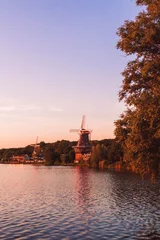 Fotobehang Purper Beautiful view of Rotterdam windmill in Kralingen  © Jonathan Rusch/Wirestock