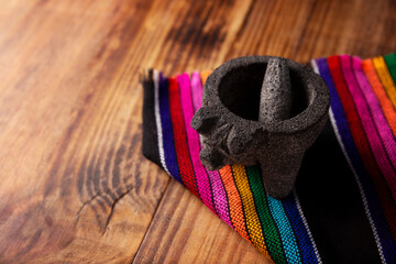 Molcajete. Traditional mexican version of mortar and pestle handmade of volcanic stone. Essential...