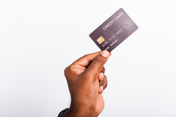 Closeup hand black man holding bank mockup money credit card on hand for payment transfer, studio shot isolated on white background
