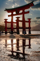Closeup of a Torii with sun on the background