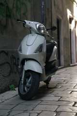 Vertical shot of white motorcycle