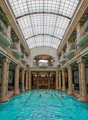 Poster Group of people swimming in an indoor pool at Gellert spa in Budapest, Hungary © Marko Klarić/Wirestock