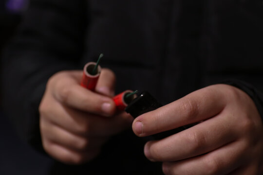 Kid Holding Dangerous Red Petards