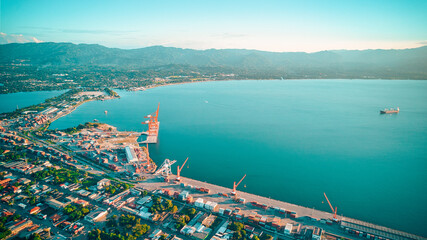 Aerial of seascape washing the shore of a harbor in Puerto Cortes, Honduras