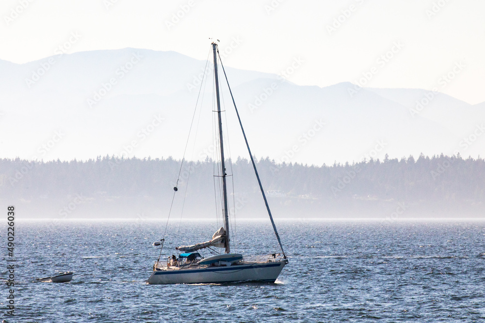 Sticker Beautiful shot of a sailboat under the cloudy skies