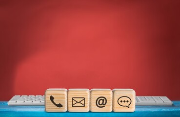 Customer support hotline. Contact us concept. Cube wood with the email, call phone, address