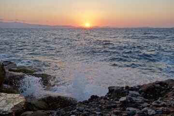 A beautiful sunset over the Aegean from the Portara or Apollo Temple on the Greek island of Naxos