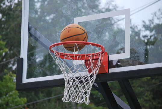 Basketball shot on a hoop in the playground