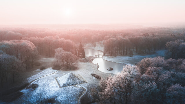 Aerial view of the Branitz park with a pyramid and lake during the wintertime in Cottbus, Germany