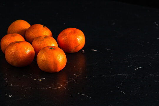 Closeup shot of mandarins on black background