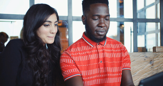 South Asian Couple Looking At A Phone Together