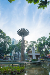 Wide angle view of Lotus pillar - An iconic architecture at Turtle lake (Ho Con Rua) with blue sky...