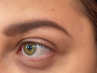 closeup of a beautiful intense yellow eye. yellow woman eye