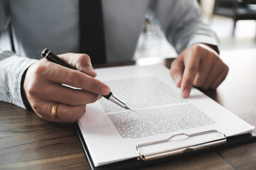 Legal counsel presents to the client a signed contract with gavel and legal law. justice and lawyer...