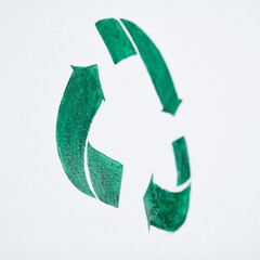 Obraz premium The way to tomorrow starts with a cleaner today. Shot of a green recycle symbol painted on a wall.