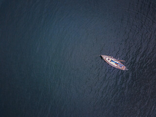 A sailboat anchored in the tranquil sea