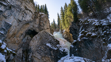 Beautiful frozen waterfall in a mountain gorge