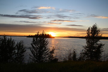 Obraz na płótnie Canvas sunset over lake, Elk Island National Park, Alberta