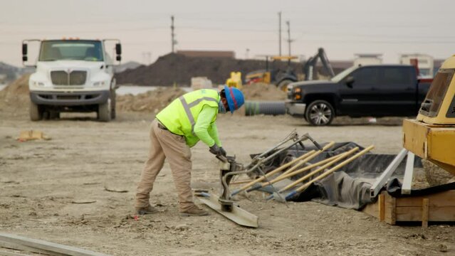 Construction Worker Cleaning Machinery Head