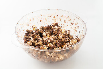 Chocolate caramel popcorn on a solid background