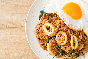 fried rice with squid and basil topped fried egg in Thai style