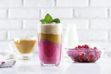 Delicious layered yogurt dessert with applesauce, raspberries and banana.