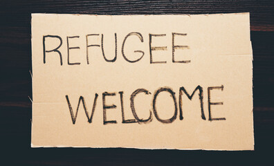pieces of paper with words Refugee Welcome message for help people concept NO WAR Russia and Ukraine