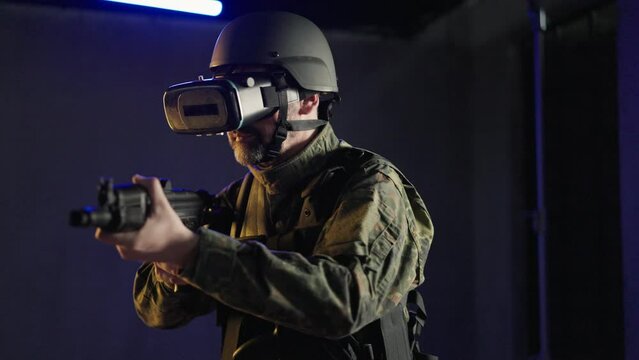 Soldier In Military Uniform Using Vr Glasses For Combat Simulation Training.