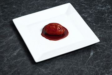 Nuegado el salvador pastry dipped in sweet caramel