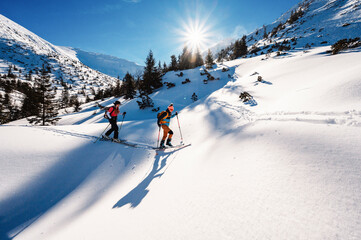 Mountaineer backcountry ski walking ski alpinist in the mountains. Ski touring in alpine landscape...