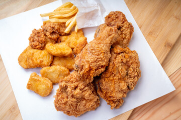 Fried chicken Crispy Chicken on white , Fried chicken set with nuggets, french fries on wooden background..