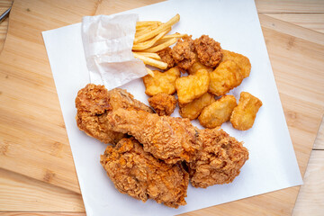 Fried chicken Crispy Chicken on white , Fried chicken set with nuggets, french fries on wooden background..